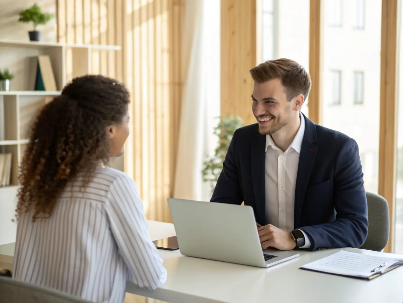 A professional photograph showcasing a team of recruiters interviewing a candidate, emphasizing the talent acquisition aspect of The Crown Bridge's services.